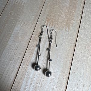 Silver dangling very light weight earring. Not real silver